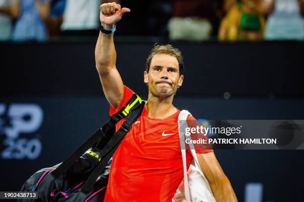 Spain's Rafael Nadal reacts as he leaves the court after his loss against Australia's Jordan Thompson at their men's singles match during the...