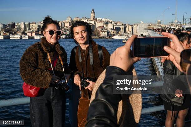 Tourists are seen spending time on Eminonu beach as daily life continues in Istanbul, Turkiye on January 05, 2024.