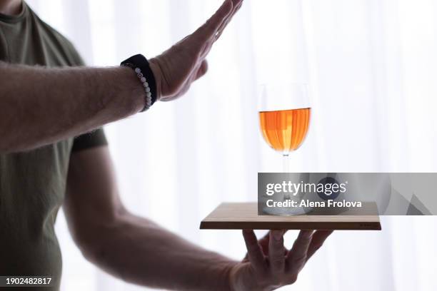 man holding glass of wine christmas dry january - yule marble stock pictures, royalty-free photos & images