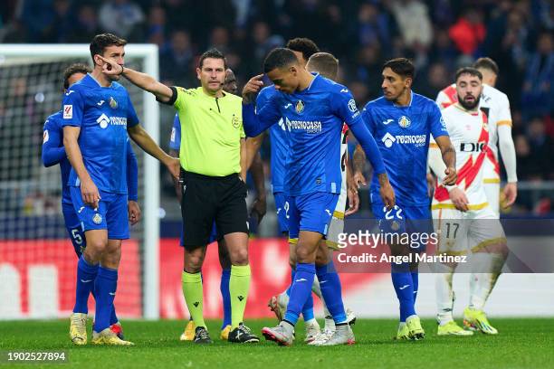 Mason Greenwood of Getafe CF is sent off by referee Jorge Figueroa Vazquez during the LaLiga EA Sports match between Getafe CF and Rayo Vallecano at...
