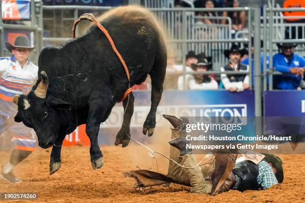 Jesse Flores is thrown by Rubicon in bull riding during the first round of Super Series I at RodeoHouston on Tuesday, Feb. 28, 2023 in Houston.