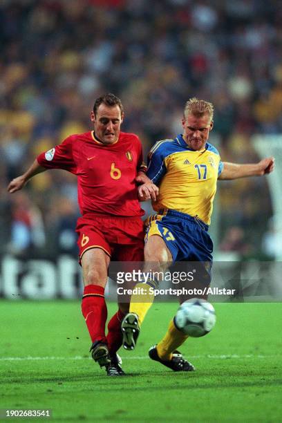 June 10: Yves Vanderhaeghe of Belgium and Johan Mjallby of Sweden challenge during the UEFA Euro 2000 Group B match between Belgium and Sweden at...