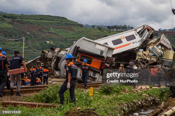 Search and rescue teams are evacuating after the Bandung Raya local train collided with the Turangga train in Cicalengka, Bandung Regency, West Java,...