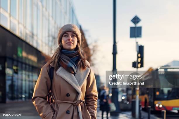 young woman sightseeing city of warsaw in on winter day - daily life in warsaw poland stock pictures, royalty-free photos & images