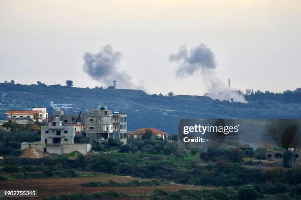 This photograph taken on January 5, 2024 from the southern Lebanese village of Dhayra along the Israeli border, shows buildings in the Lebanese town...