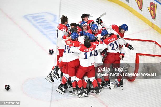 Czech Republic's players celebrate after the bronze medal match between Czech Republic and Finland of the IIHF World Junior Championship in...