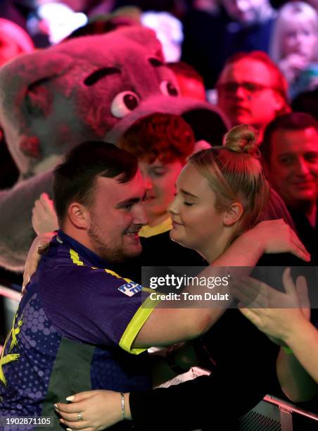 Luke Littler of England is seen with his girlfriend, Eloise Milburn prior to his semi final match against Rob Cross of England on day 15 of the...