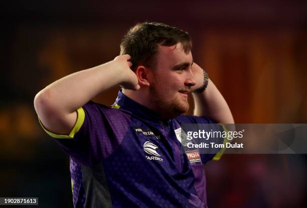 Luke Littler of England celebrates during his semi final match against Rob Cross of England on day 15 of the 2023/24 Paddy Power World Darts...