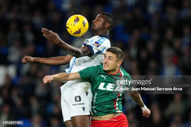 Umar Sadiq of Real Sociedad controls the ball whilst under pressure from Nahuel Tenaglia of Deportivo Alaves during the LaLiga EA Sports match...