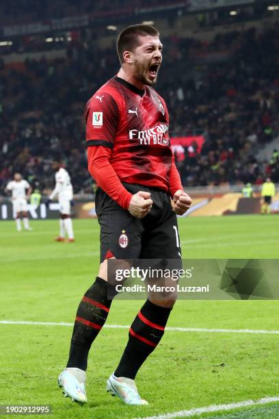 Luka Jovic of AC Milan celebrates after scoring their team's first goal during the Coppa Italia match between AC Milan and Cagliari Calcio at San...