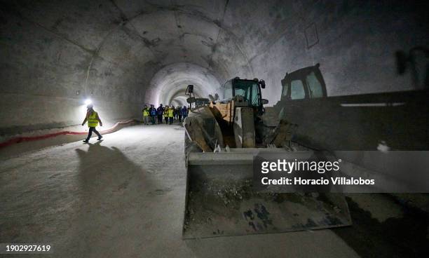 Visitors walk in the tunnel under construction during Portuguese Prime Minister Antonio Costa visit with the Minister of the Environment and Climate...