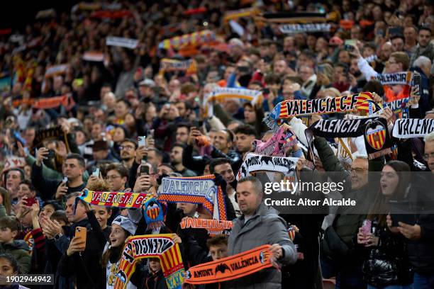 Fans of Valencia CF raise their scarfs during the LaLiga EA Sports match between Valencia CF and Villarreal CF at Estadio Mestalla on January 02,...