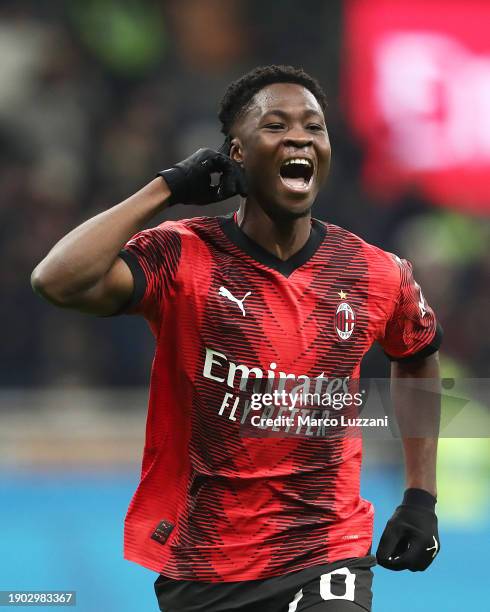 Chaka Traore of AC Milan celebrates scoring their team's third goal during the Coppa Italia match between AC Milan and Cagliari Calcio at San Siro on...