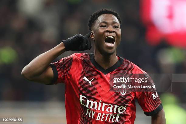 Chaka Traore of AC Milan celebrates scoring their team's third goal during the Coppa Italia match between AC Milan and Cagliari Calcio at San Siro on...