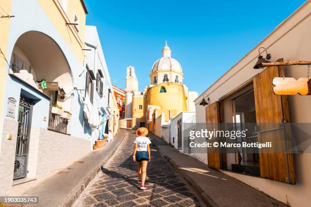tourist walking in procida, gulf of naples, italy - italian island photos et images de collection