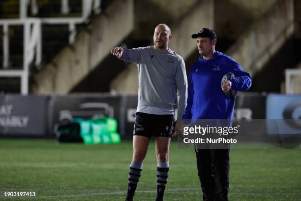 Alex Codling, the head coach of Newcastle Falcons, is chatting with Seb de Chaves before the Gallagher Premiership match between Newcastle Falcons...