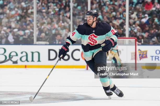 Jamie Oleksiak of the Seattle Kraken skates back on defense during the first period of the 2024 Discover NHL Winter Classic against the Vegas Golden...