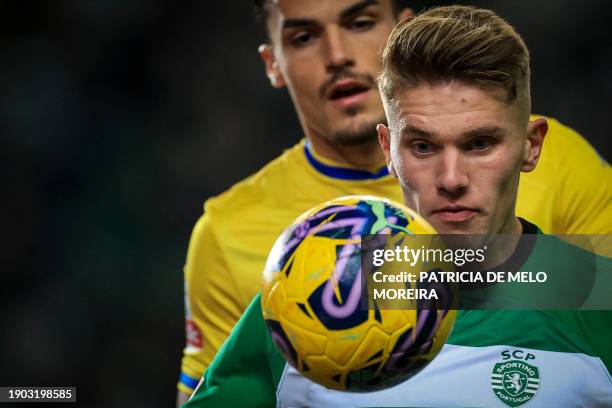 Sporting's Portuguese forward Viktor Gyokeres vies with Estoril's Portuguese defender Pedro Alvaro during the Portuguese League football match...