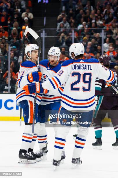 Edmonton Oilers center Ryan McLeod , Edmonton Oilers left wing Warren Foegele and Edmonton Oilers center Leon Draisaitl celebrate a goal during an...