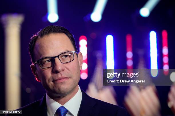 Governor of Pennsylvania Josh Shapiro prepares to speak during a television interview before U.S. President Joe Biden takes the stage during a...
