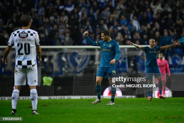 Porto's Spanish forward Toni Martinez celebrates scoring his team's first goal during the Portuguese League football match between Boavista FC and FC...