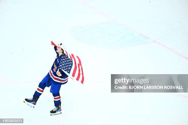 Player celebrates after winning the final of the IIHF World Junior Championship ice hockey match between USA and Sweden in Gothenburg, Sweden on...