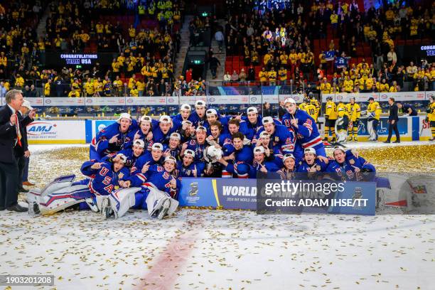 S players celebrate after winning the final of the IIHF World Junior Championship ice hockey match between USA and Sweden in Gothenburg, Sweden on...