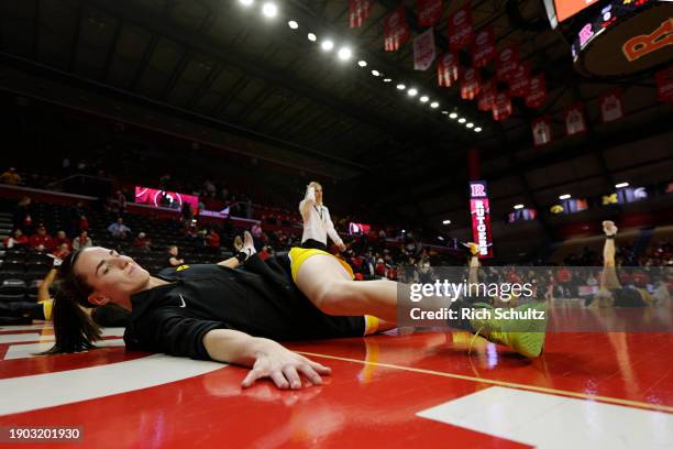 Caitlin Clark of the Iowa Hawkeyes stretches before a game against the Rutgers Scarlet Knights at Jersey Mike's Arena on January 5, 2024 in...