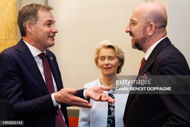 European Commission President Ursula Von der Leyen reacts as Belgium Prime Minister Alexander De Croo and European Council President Charles Michel...