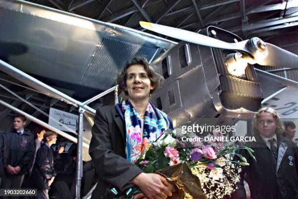 Nathalie Des Vallieres, great niece of the French writer and pilot Antoine de Saint-Exupery, stands before the Latecoere 25 airplane in Buenos Aires...