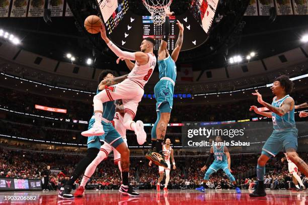 Zach Lavine of the Chicago Bulls passes off the ball in the first half against the Charlotte Hornets on January 05, 2024 at United Center in Chicago,...