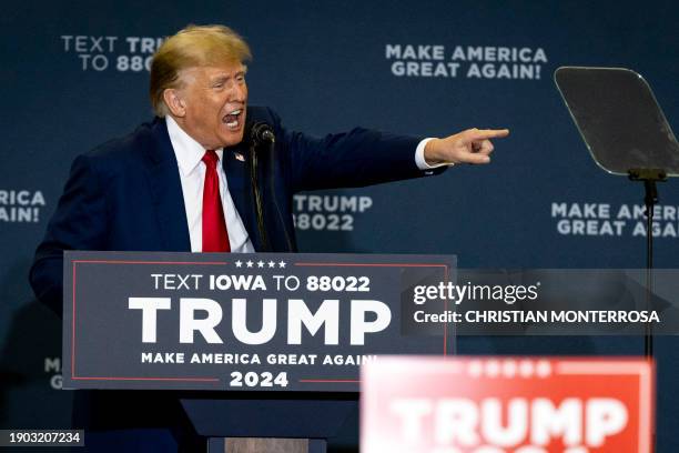 Former US President and Republican presidential hopeful Donald Trump speaks during a "Commit to Caucus" rally at the North Iowa Events Center in...