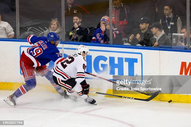 New York Rangers Defenseman K'Andre Miller skates against Chicago Blackhawks Center Brett Seney during the third period of the National Hockey League...
