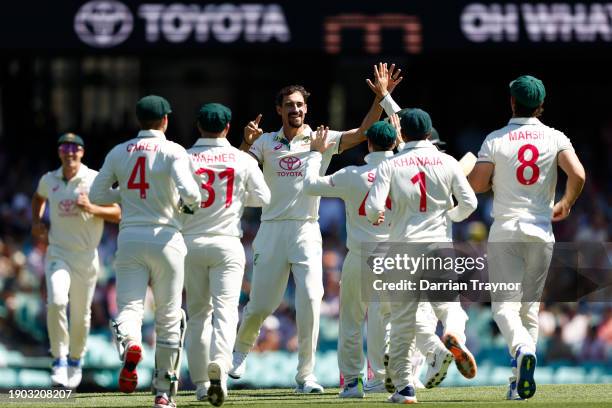 Mitchell Starc of Australia celebrates the wicket of Abdullah Shafique of Pakistan during day one of the Men's Third Test Match in the series between...