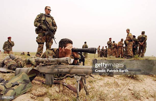 Soldiers of Joint Special Operations Task Force stay alert on the front line of the northern front of the war in Iraq April 7, 2003 in Pir Daud,...