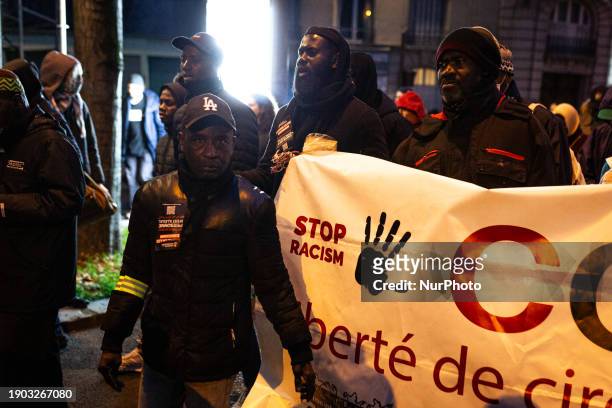 In Paris, France, on May 1 hundreds of people are participating in a demonstration against Interior Minister Gerald Darmanin's new immigration law,...