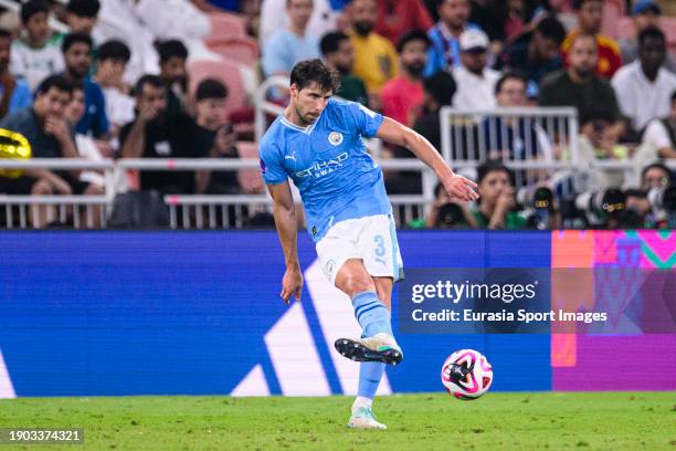 Ruben Dias of Manchester City passes the ball during the FIFA Club World Cup Final match between Manchester City and Fluminense at King Abdullah...