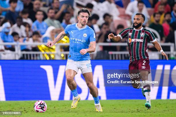 Samuel Xavier of Fluminense chases Jack Grealish of Manchester City during the FIFA Club World Cup Final match between Manchester City and Fluminense...