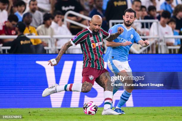 Felipe Melo of Fluminense passes the ball while is blocked by Bernardo Silva of Manchester City during the FIFA Club World Cup Final match between...