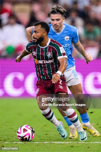 Samuel Xavier of Fluminense is chased by Jack Grealish of Manchester City during the FIFA Club World Cup Final match between Manchester City and...