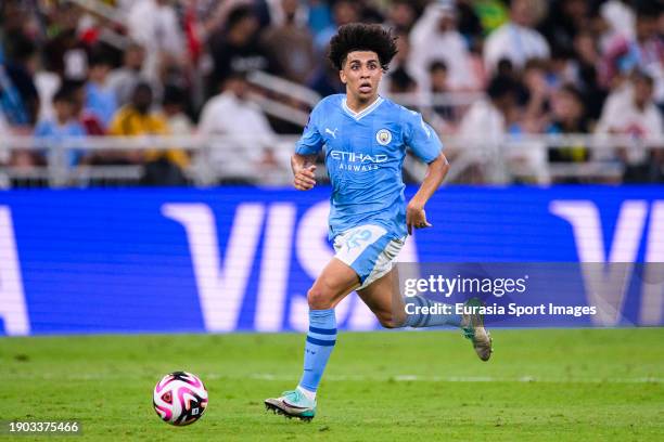 Rico Lewis of Manchester City runs with the ball during the FIFA Club World Cup Final match between Manchester City and Fluminense at King Abdullah...