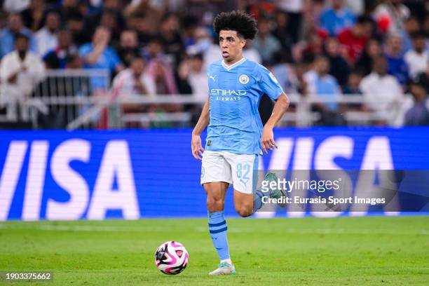 Rico Lewis of Manchester City runs with the ball during the FIFA Club World Cup Final match between Manchester City and Fluminense at King Abdullah...