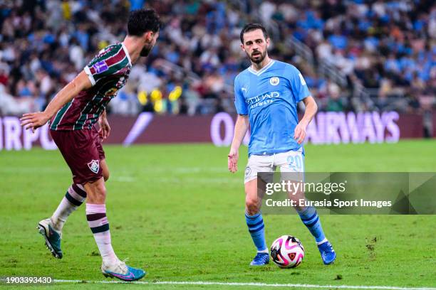 Bernardo Silva of Manchester City plays against Matheus Martinelli of Fluminense during the FIFA Club World Cup Final match between Manchester City...