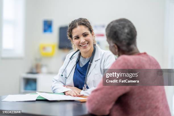 women's health appointment - primary health care stock pictures, royalty-free photos & images