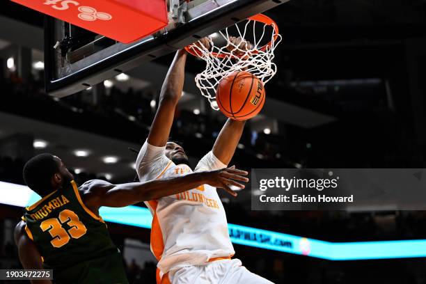 Jonas Aidoo of the Tennessee Volunteers dunks against Jack Doumbia of the Norfolk State Spartans in the second half at Thompson-Boling Arena on...