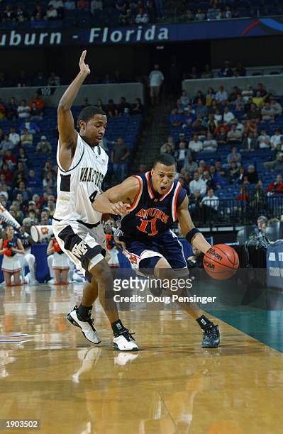 Derrick Bird of the Auburn University Tigers drives the ball past Taron Downey of the Wake Forest University Deacons as the Tigers defeated the...