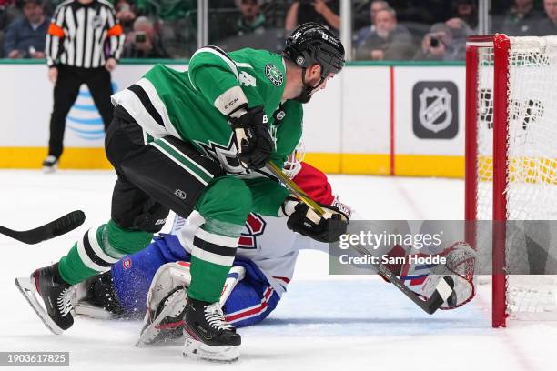 Sam Montembeault of the Montreal Canadiens stops a shot from Jamie Benn of the Dallas Stars during the third period at American Airlines Center on...