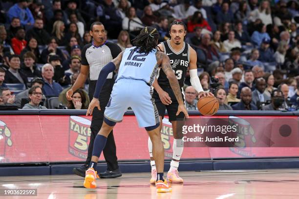 Tre Jones of the San Antonio Spurs handles the ball against Ja Morant of the Memphis Grizzlies during the second half at FedExForum on January 02,...