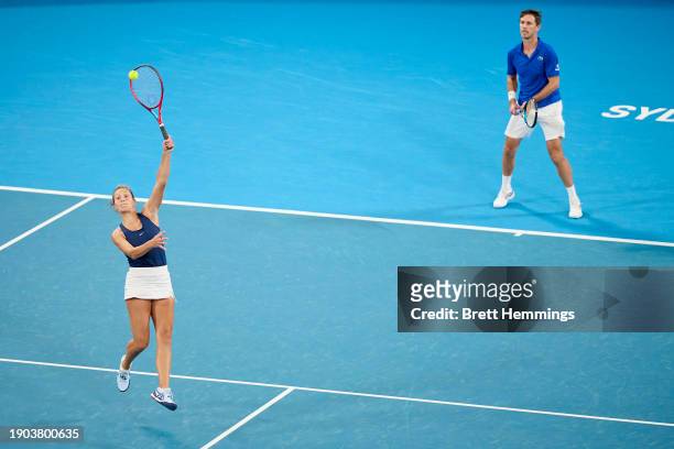 Elixane Lechemia of France and Edouard Roger-Vasselin of France compete in their Group D doubles match against Nuria Brancaccio of Italy and Flavio...