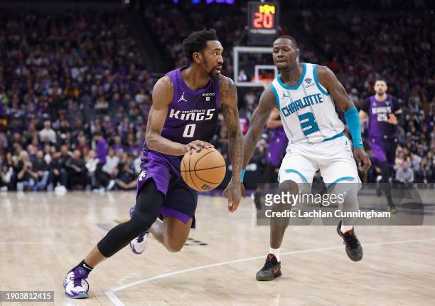 Malik Monk of the Sacramento Kings drives to the basket against Terry Rozier of the Charlotte Hornets in the fourth quarter at Golden 1 Center on...